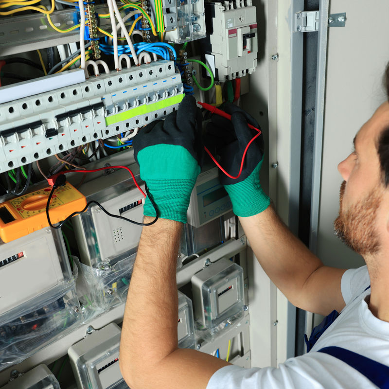 someone repairing an electrical panel